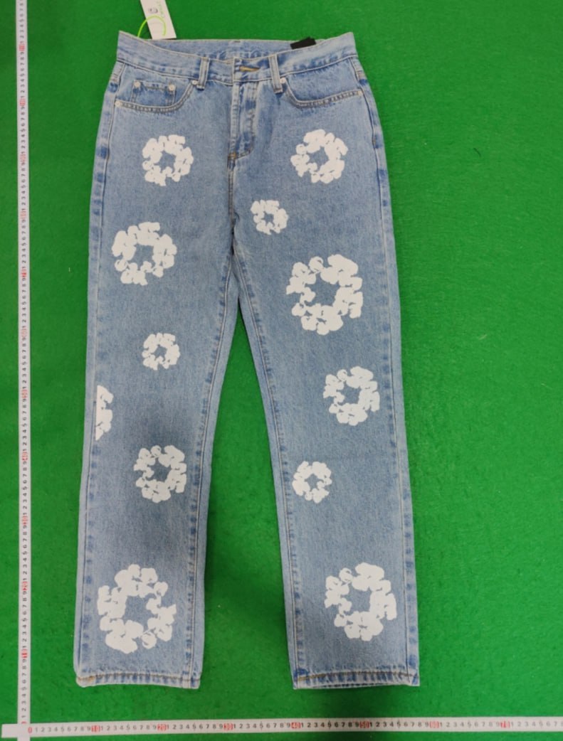 DENIM TEARS  Trousers