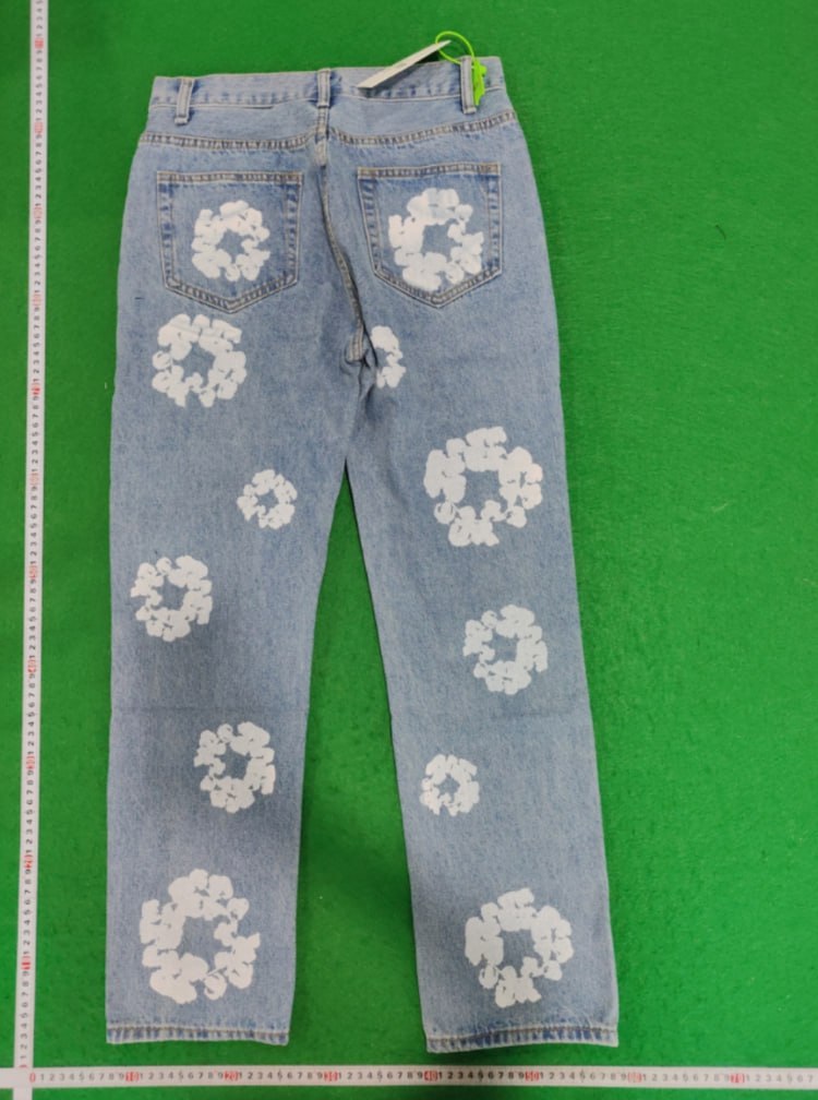 DENIM TEARS  Trousers